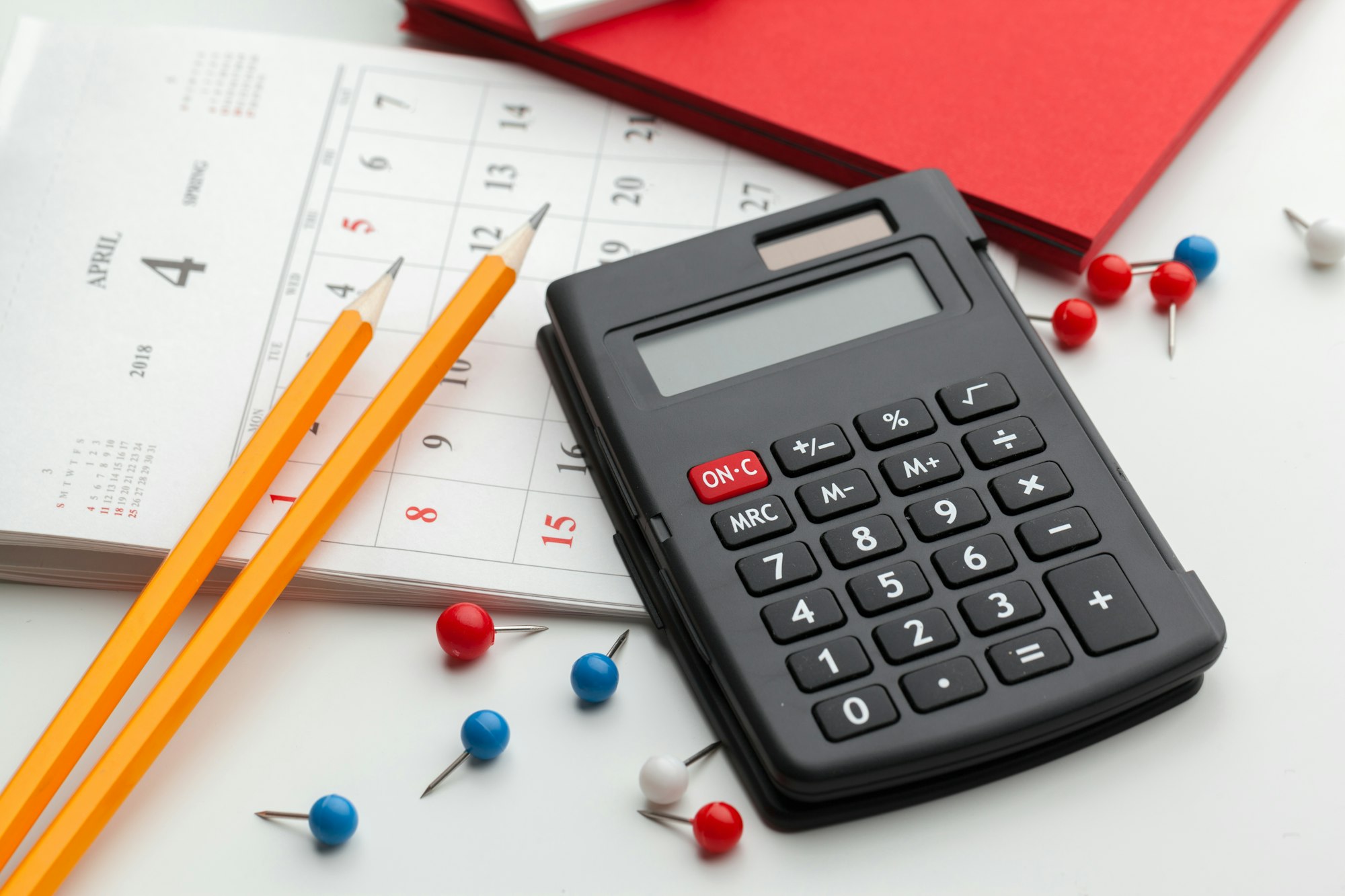 Business still life with calculator on table in office